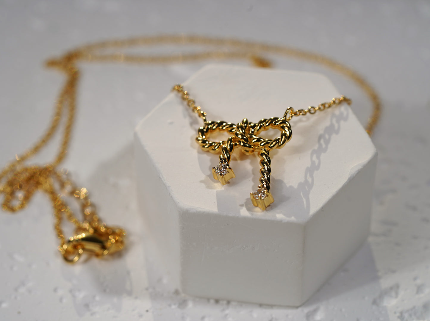 Gold Plated Sterling Silver Necklace with Bow Pendant and Cubic Zirconia Adornment