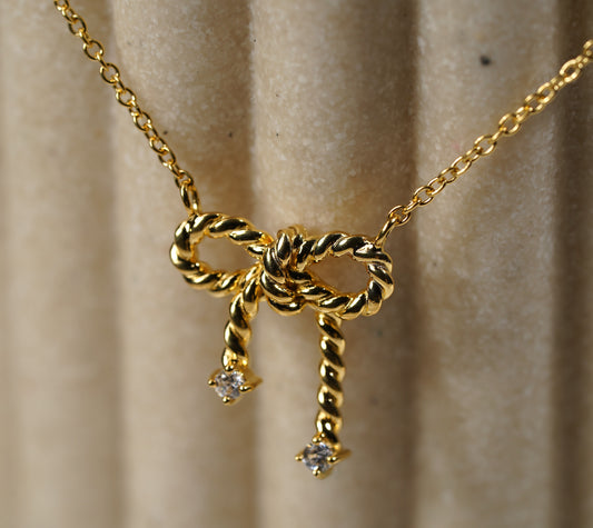 Gold Plated Sterling Silver Necklace with Bow Pendant and Cubic Zirconia Adornment