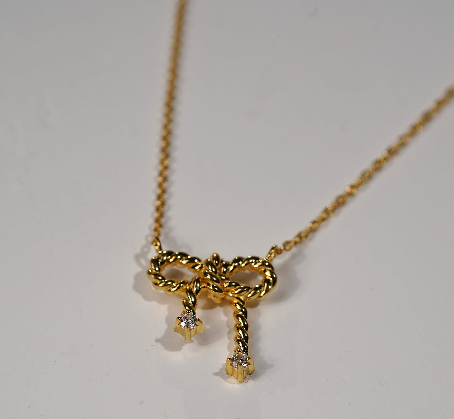 Gold Plated Sterling Silver Necklace with Bow Pendant and Cubic Zirconia Adornment