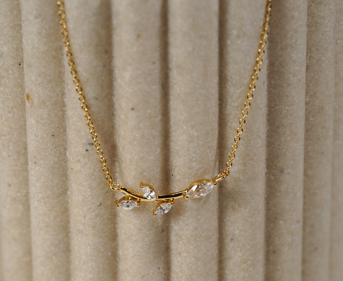 Gold plated branch and leaf necklace with CZ adornment