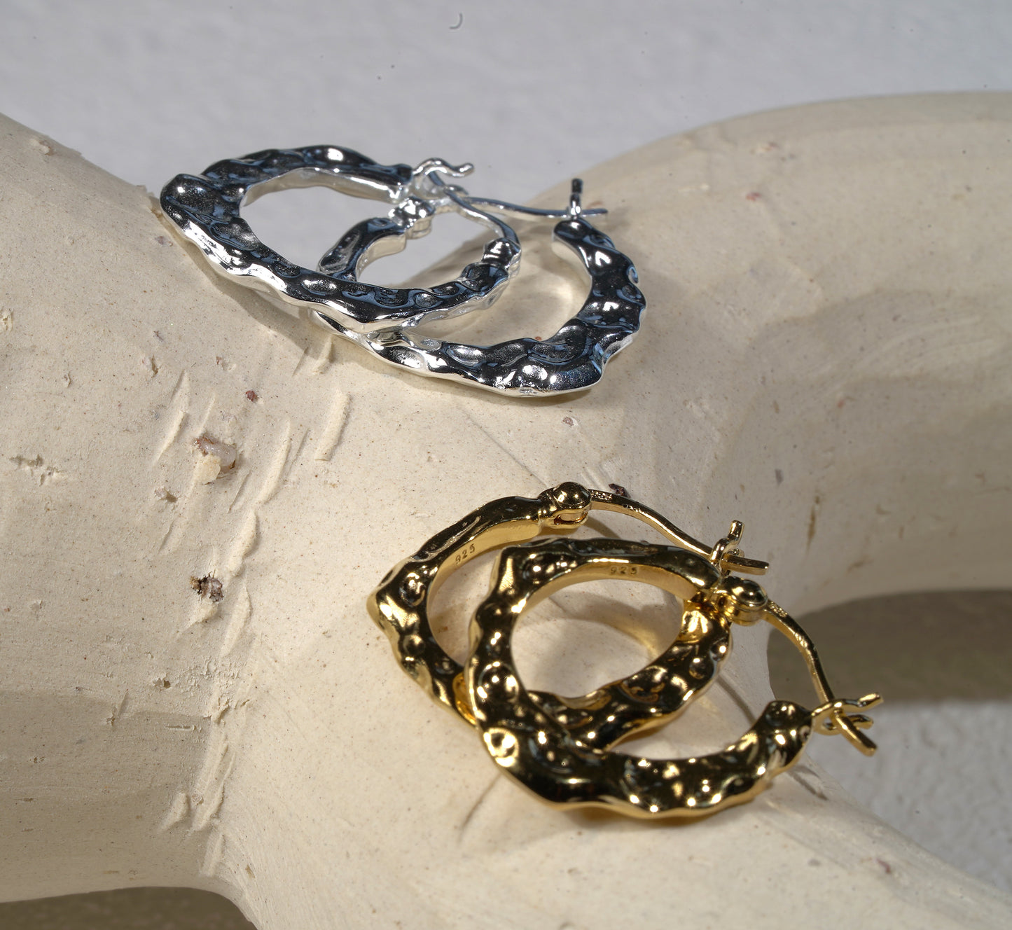 Gold and silver hand hammered hoop earring