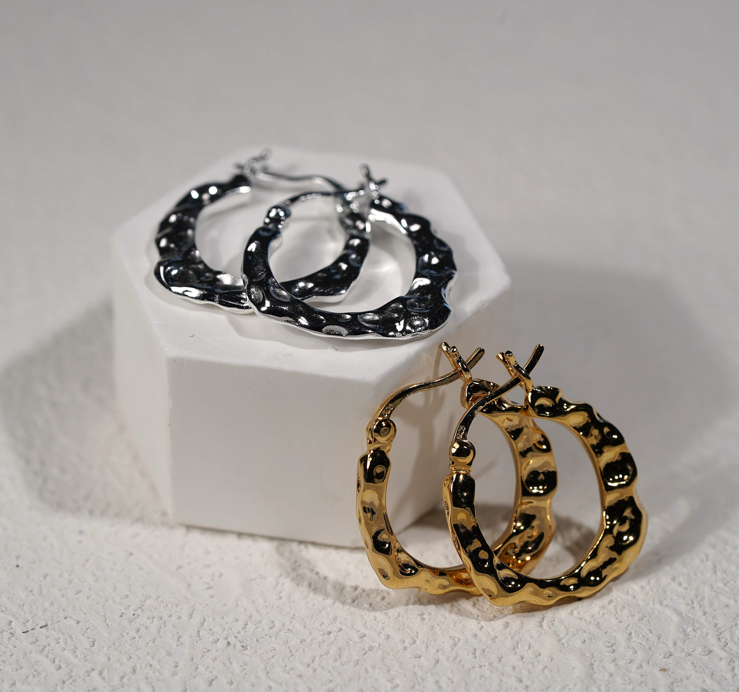 Hand hammered gold and silver hoop earring