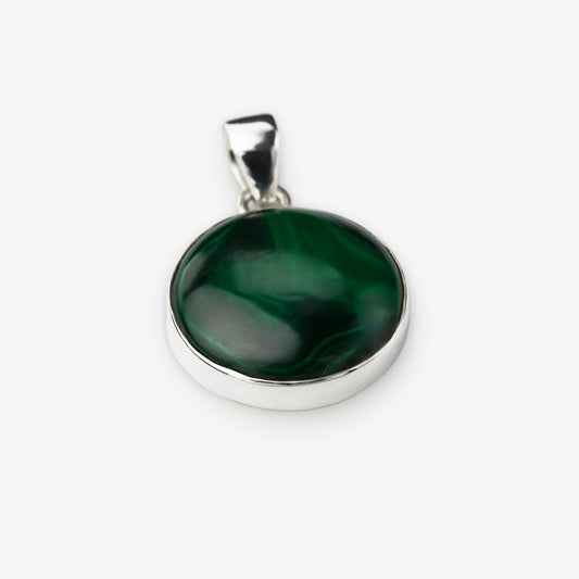 A round silver pendant featuring a polished dark green malachite stone with natural swirling patterns, set in a silver bezel with a silver bail, shown on a light gray background.