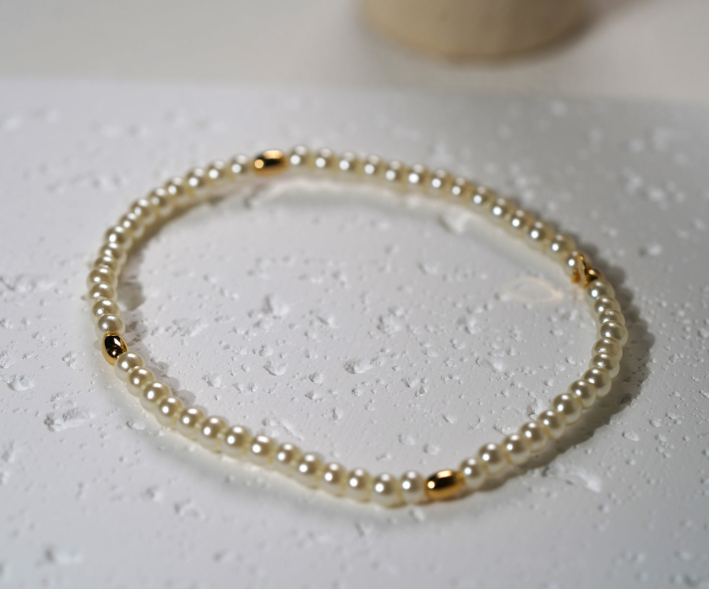 Glass Pearl Elastic Bracelet with Gold Plated Feature - Griha Threads & Treasure