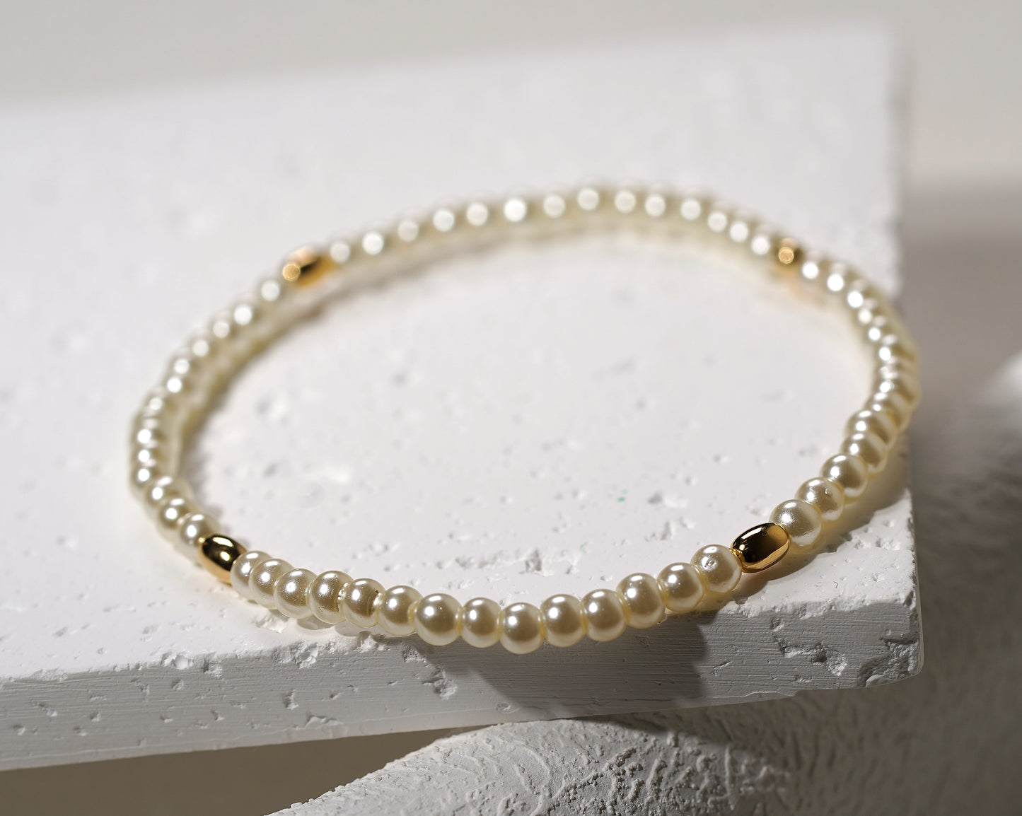 Glass Pearl Elastic Bracelet with Gold Plated Feature - Griha Threads & Treasure