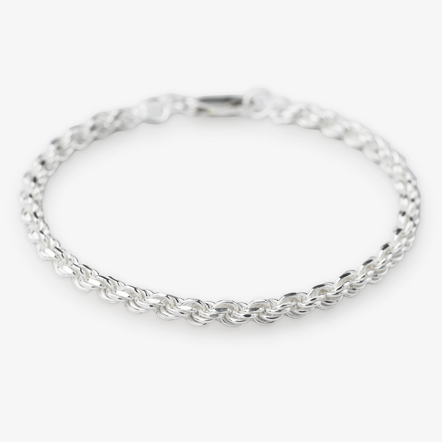 Sterling silver woven rope bracelet 925 silver on white background modern silver jewellery