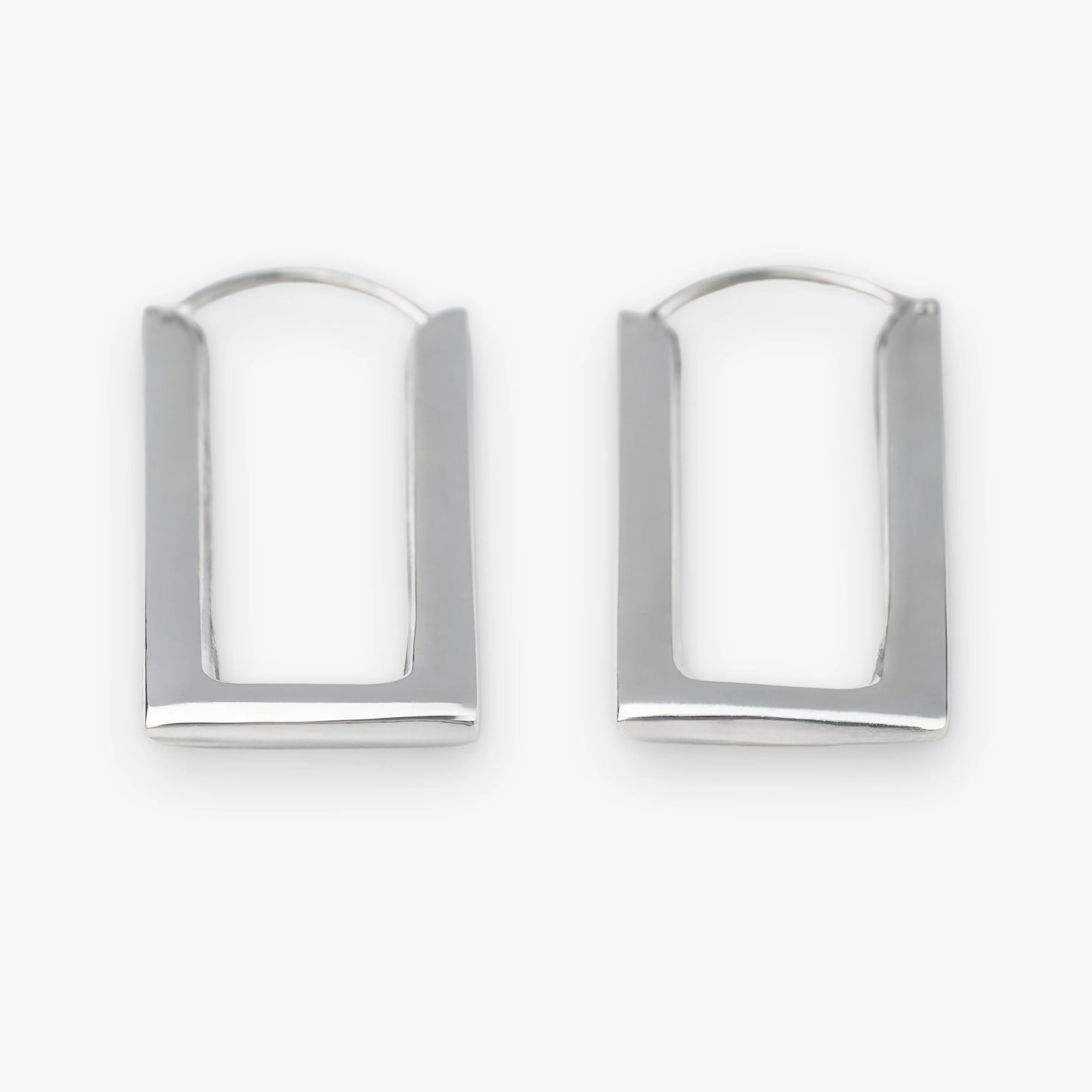 A pair of sterling silver geometric hoop earrings with a modern, open rectangular arch design, displayed on a clean white background.
