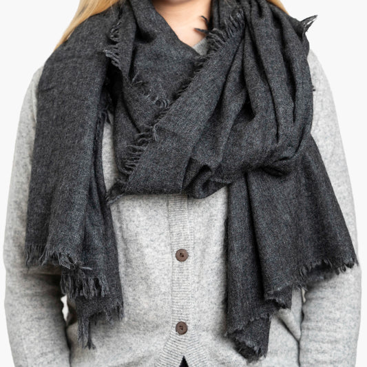 Charcoal Pure Yak Wool Shawl draped around shoulders, showing hand-frayed fringe edging
