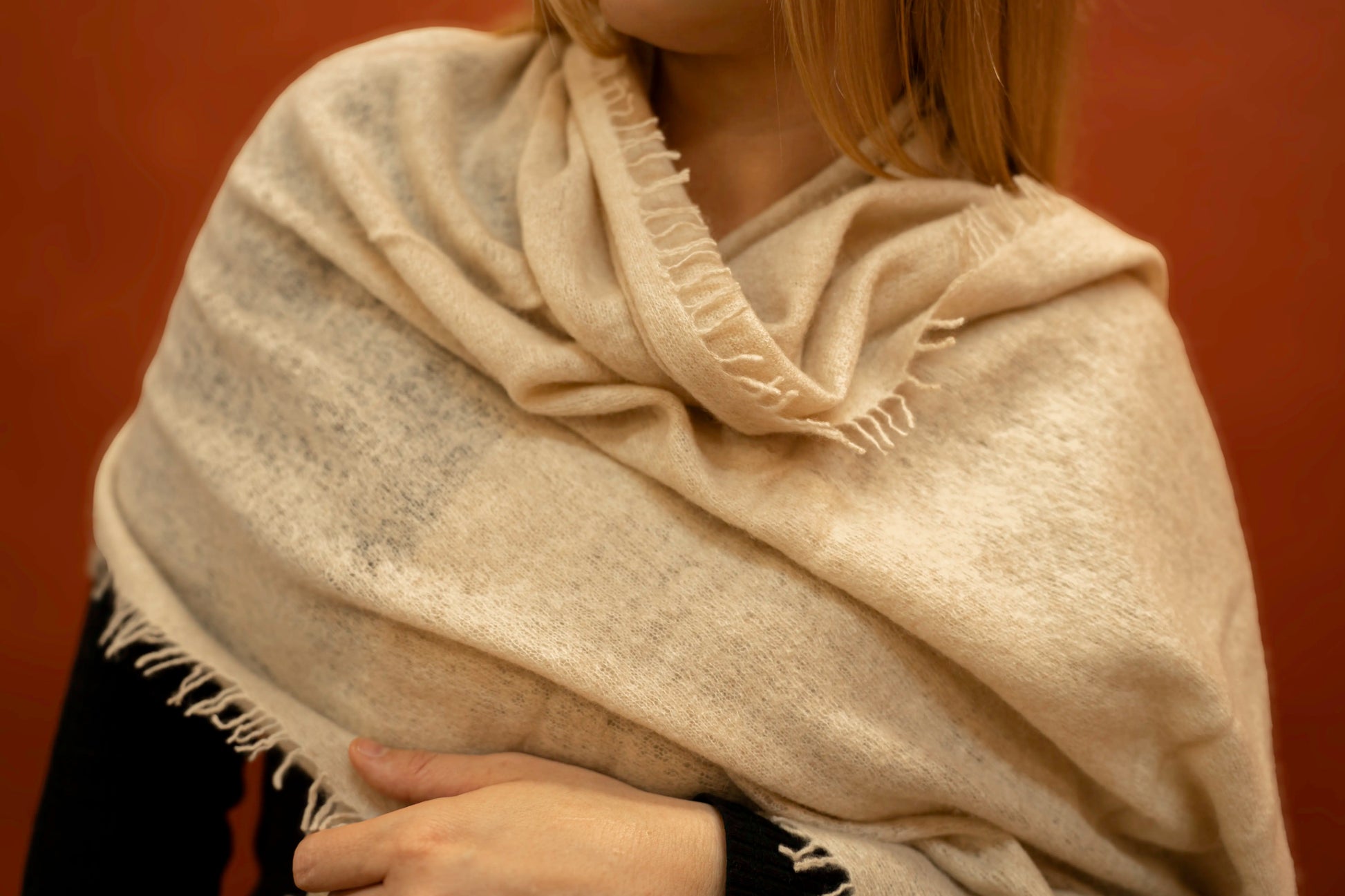Close-up of beige pure woven cashmere shawl showing open weave texture and fringe trim — Griha Himalayan cashmere