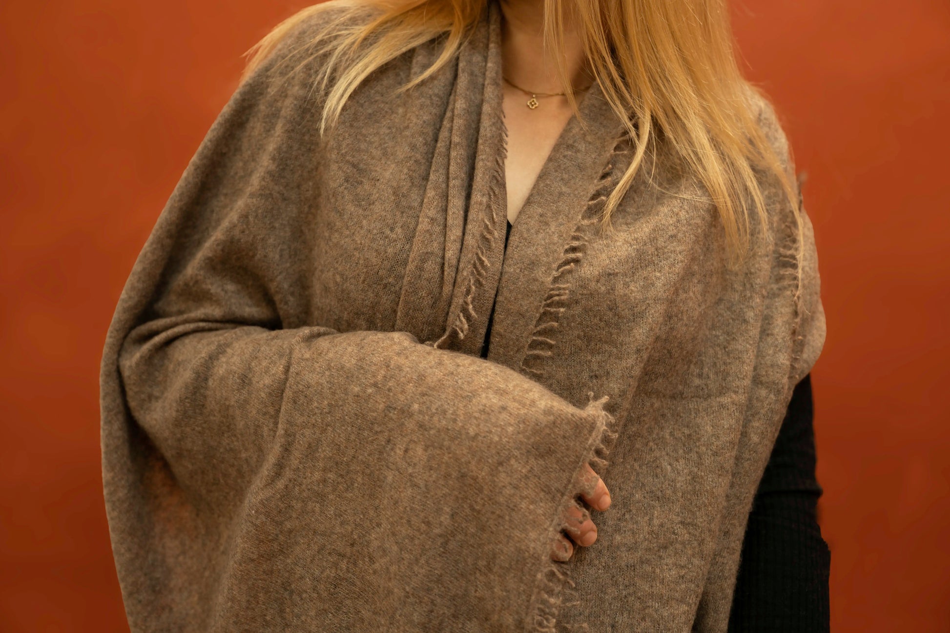 Close-up of taupe brown pure woven cashmere shawl showing open weave texture and fringe trim — Griha Himalayan cashmere