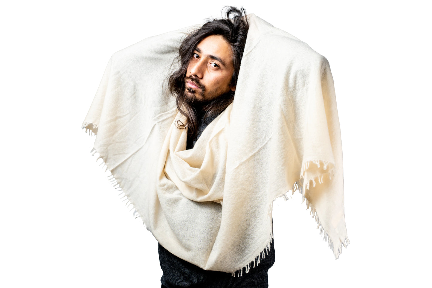 Man wearing a white cashmere shawl against a white background