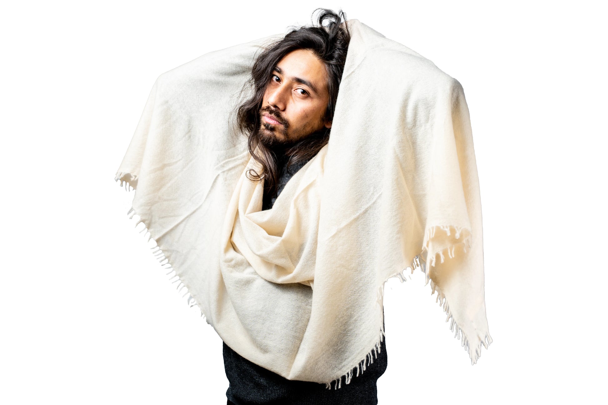 Man wearing a white cashmere shawl against a white background
