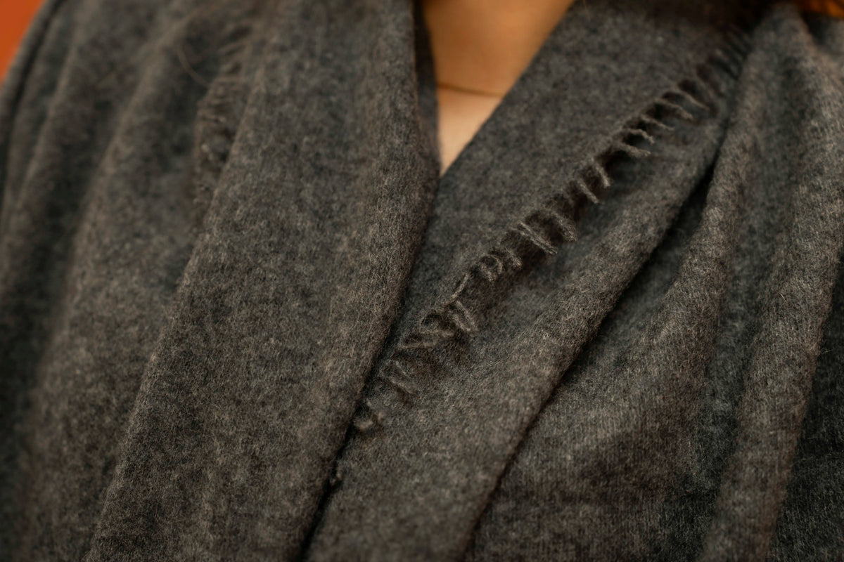 Close-up of charcoal pure woven cashmere shawl showing open weave texture — Griha Himalayan cashmere