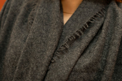 Close-up of charcoal pure woven cashmere shawl showing open weave texture — Griha Himalayan cashmere
