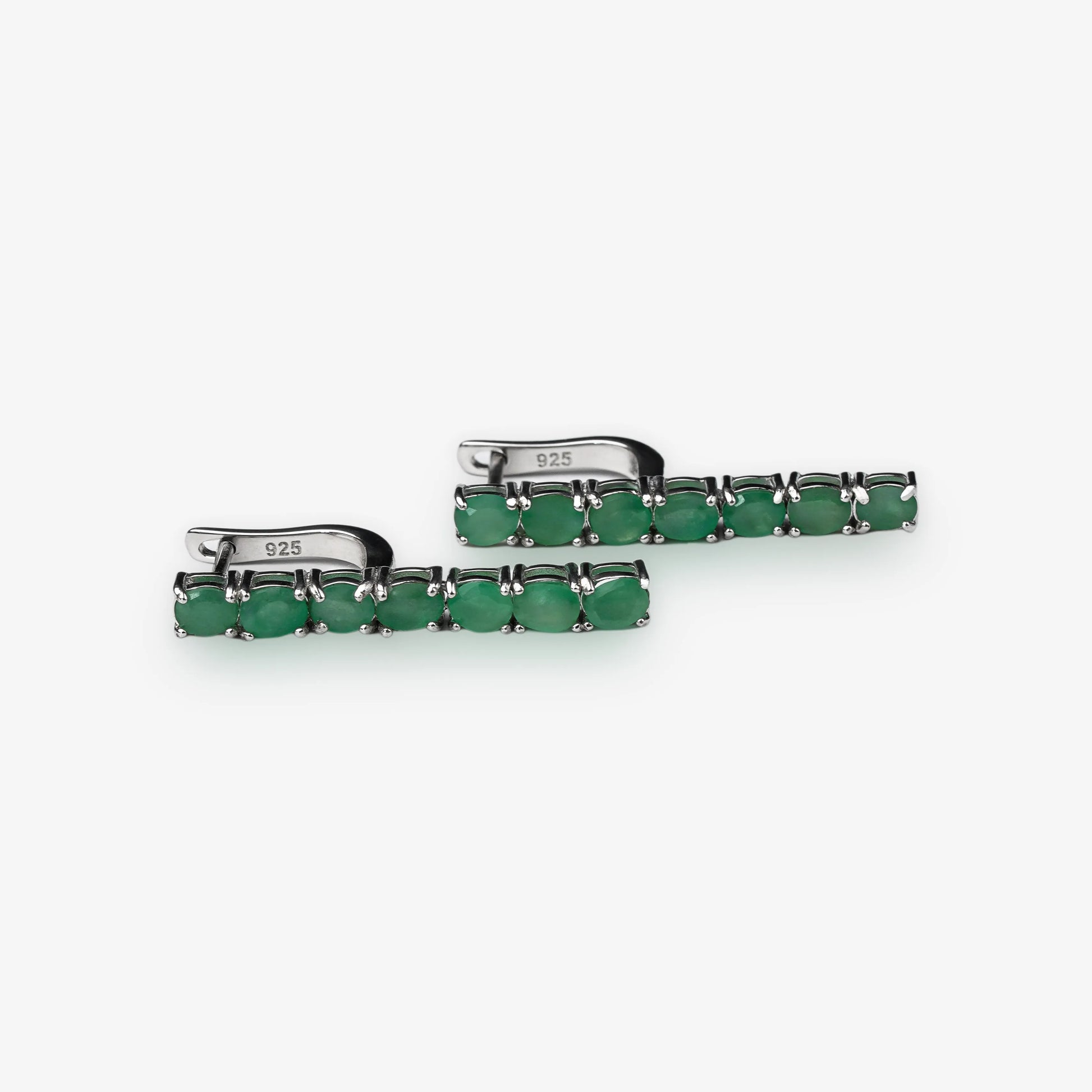 Sterling silver emerald gemstone drop earrings tennis style with hook clasp on white background