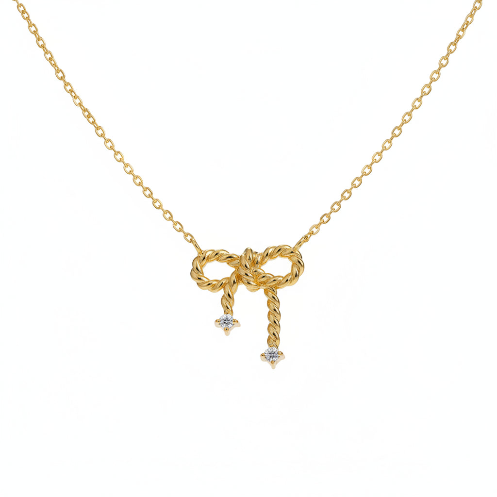 Gold Plated Sterling Silver Necklace with Bow Pendant and Cubic Zirconia Adornment