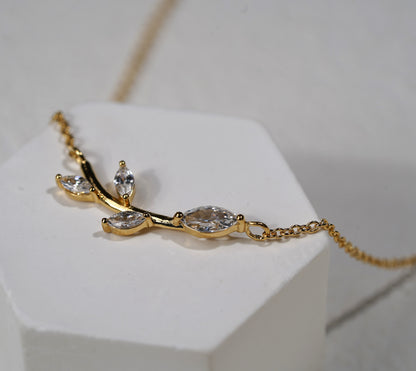 Gold plated branch and leaf necklace with CZ adornment
