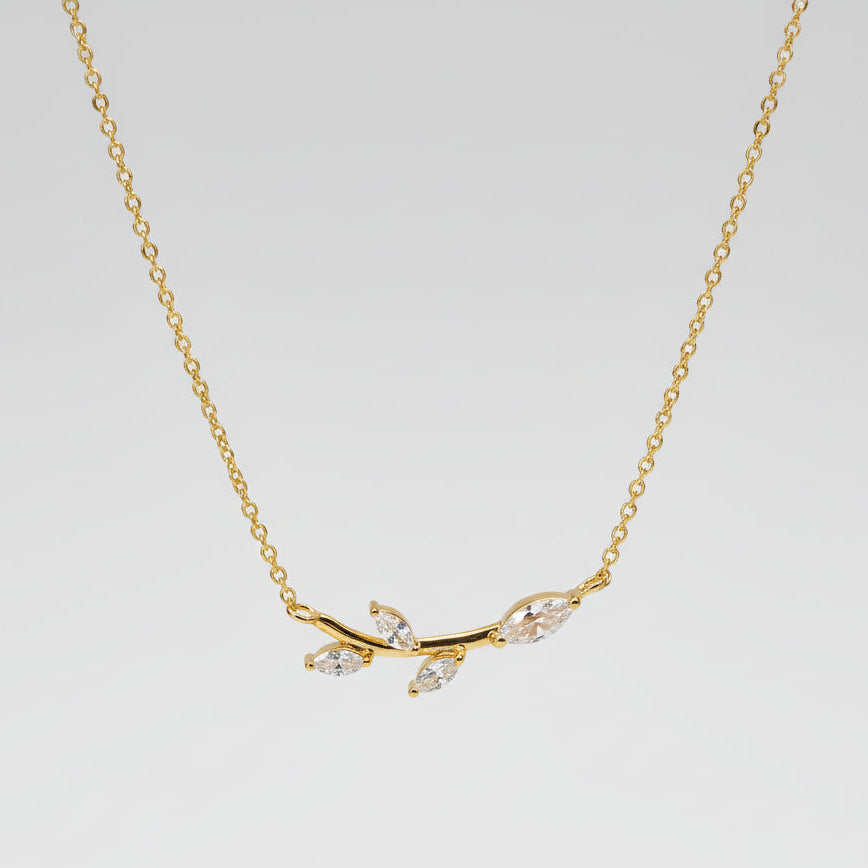 Gold plated branch and leaf necklace with CZ adornment