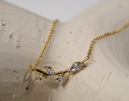 Gold plated branch and leaf necklace with CZ adornment