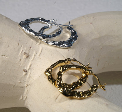 Gold and silver hand hammered hoop earring