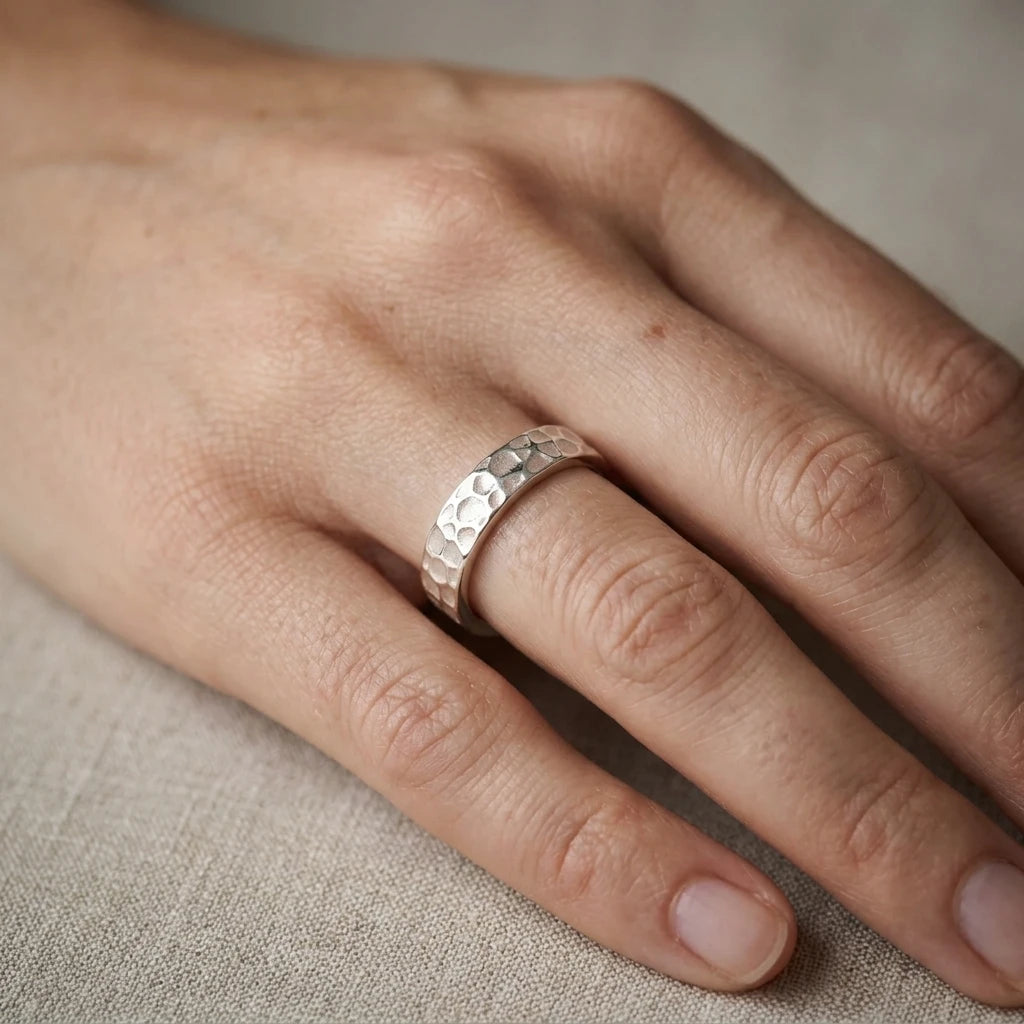 Hammered Silver Everyday Band Ring on a models hand 
