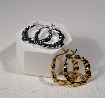 Hand hammered gold and silver hoop earring