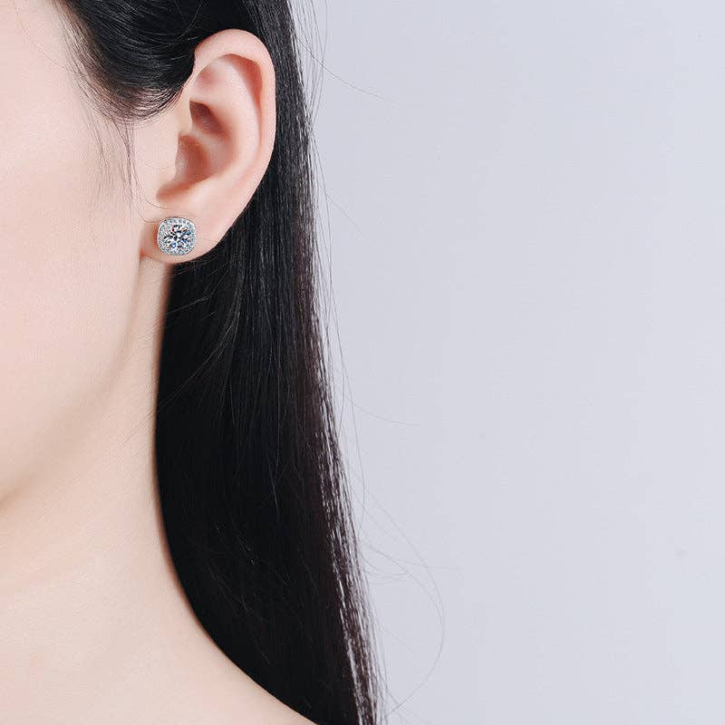Moissanite four prong encased stud earrings