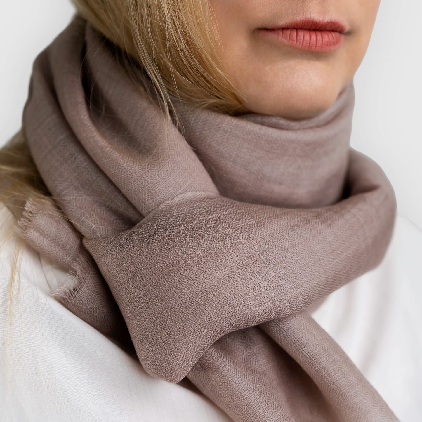 pashmina shawl scarf close up wrapped around model neck in mushroom colour
