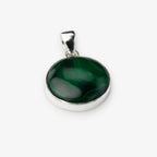 A round silver pendant featuring a polished dark green malachite stone with natural swirling patterns, set in a silver bezel with a silver bail, shown on a light gray background.