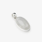 An oval pendant featuring a milky white translucent moonstone set in a polished silver bezel and bail, shown on a clean white background.