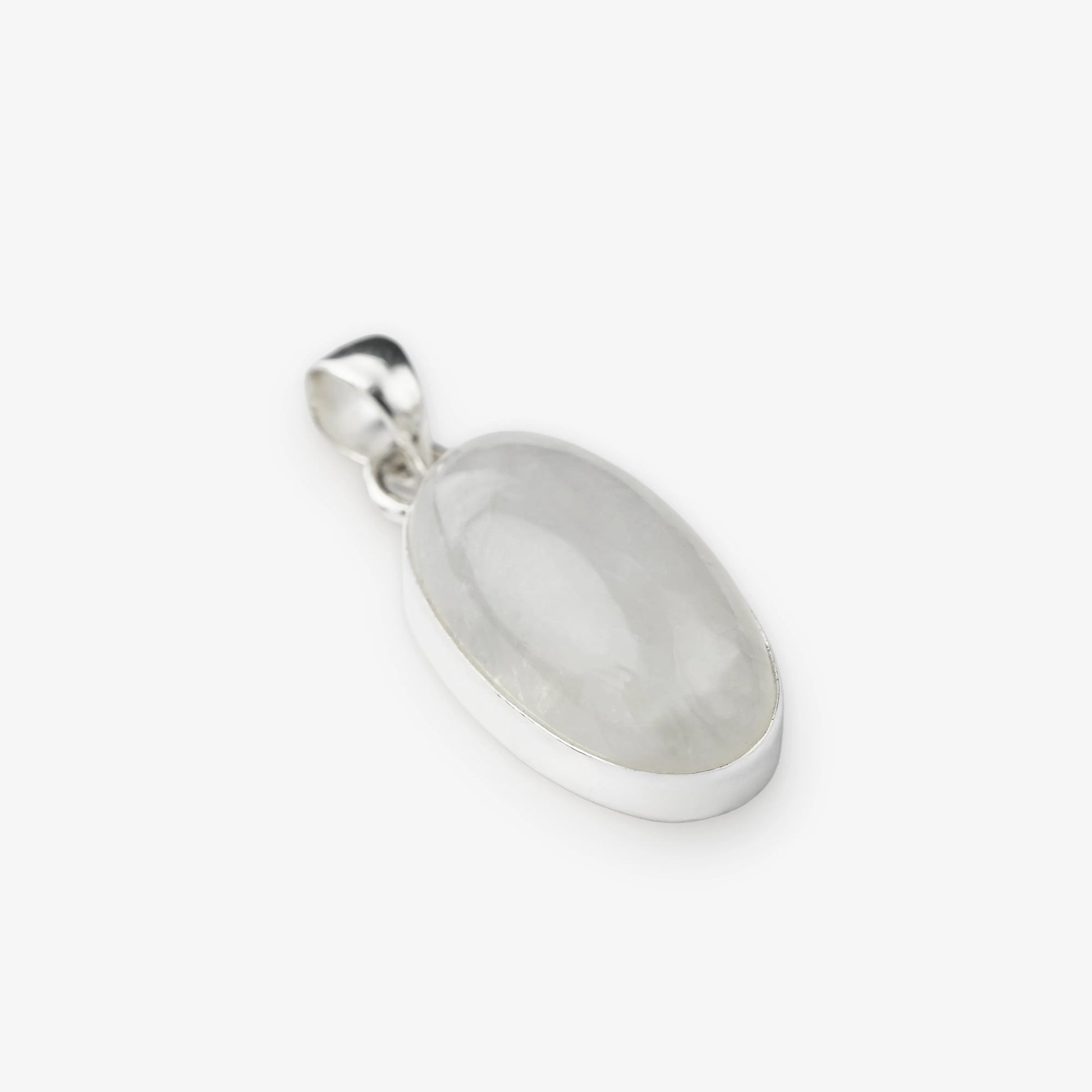 An oval pendant featuring a milky white translucent moonstone set in a polished silver bezel and bail, shown on a clean white background.