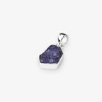 Tanzanite gemstone pendant natural cut stone set in sterling silver on white background