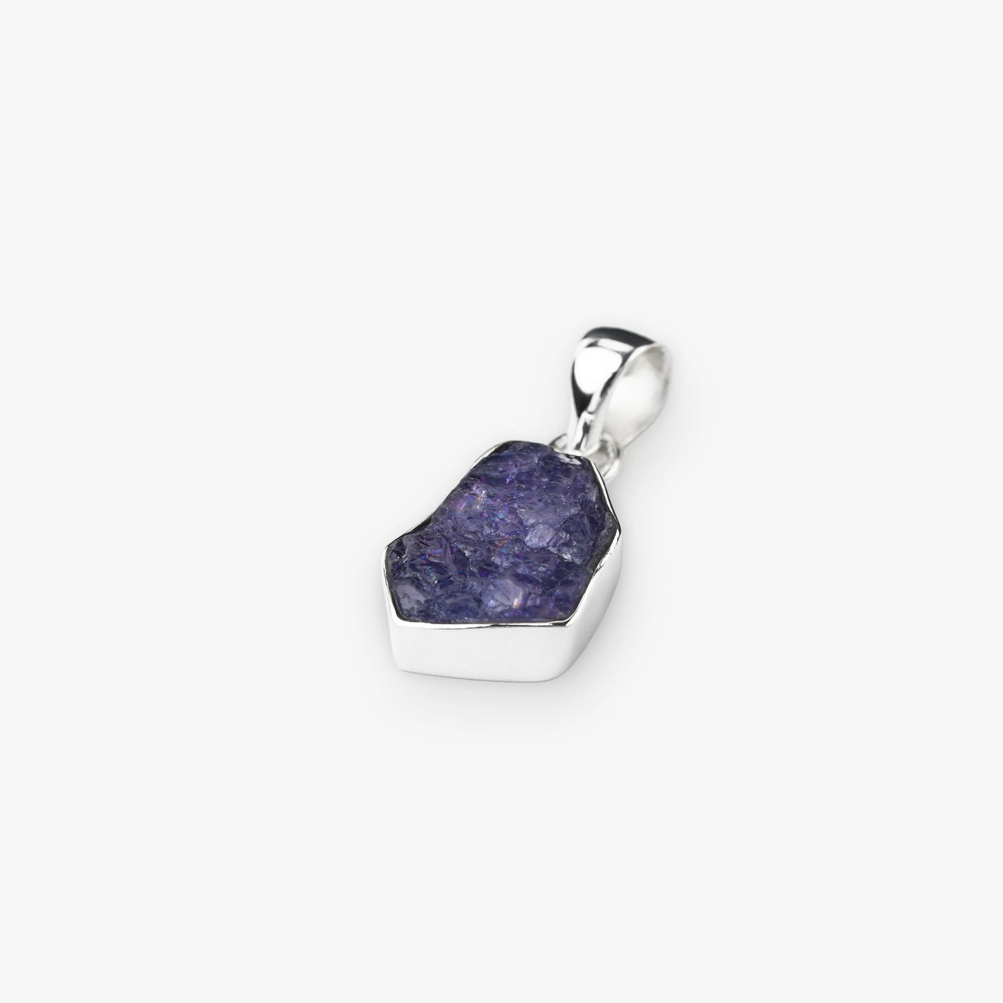 Tanzanite gemstone pendant natural cut stone set in sterling silver on white background