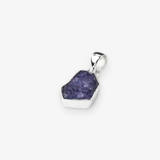 Tanzanite gemstone pendant natural cut stone set in sterling silver on white background