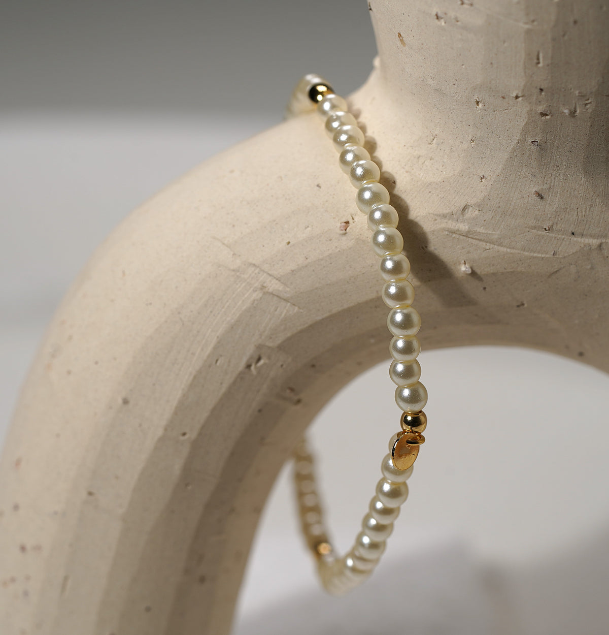 Glass Pearl Elastic Bracelet with Gold Plated Feature - Griha Threads & Treasure