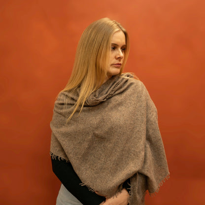 Taupe brown woven cashmere shawl draped as shoulder wrap — handcrafted in Nepal by Griha