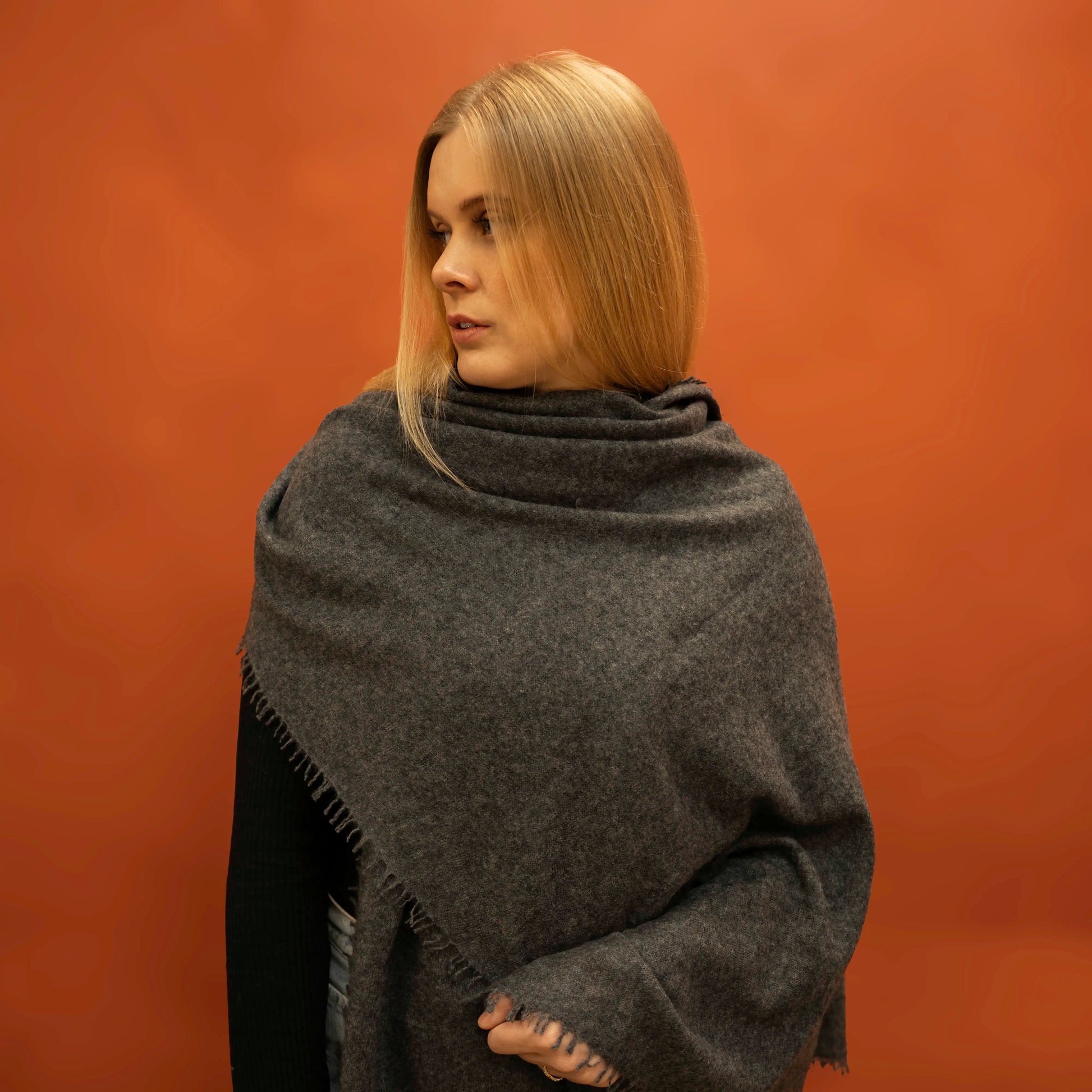 Charcoal woven cashmere shawl draped as shoulder wrap — handcrafted in Nepal by Griha