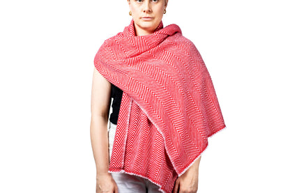 Person wearing a red and white patterned pashmina shawl on a white background- GRIHA