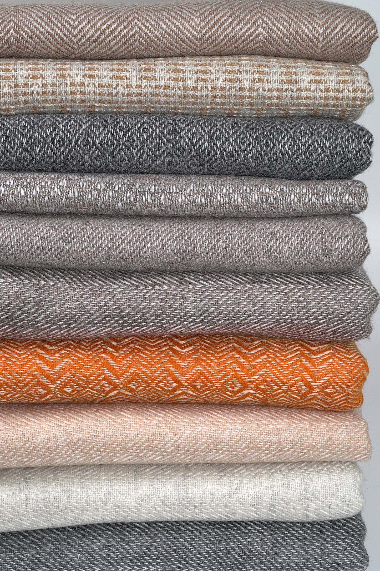 Stack of Pashmina Shawls showing various colours and patterns