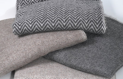 Stack of Pashminas Together Showcasing Various Textures, Weaves and Colours