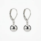 A pair of polished silver leverback drop earrings with smooth, reflective spherical beads hanging from the hooks, shown against a plain white background.