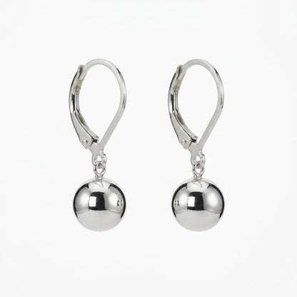 A pair of polished silver leverback drop earrings with smooth, reflective spherical beads hanging from the hooks, shown against a plain white background.