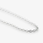 A close-up of a polished silver belcher chain necklace with oval links, shown against a clean white background.
