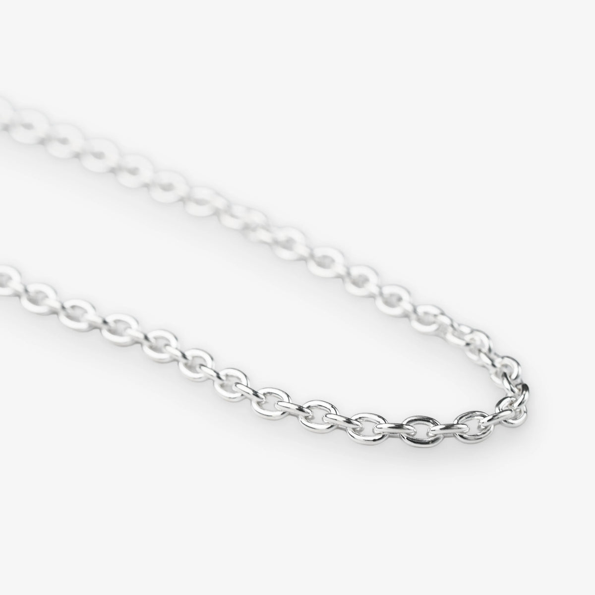 A close-up of a polished silver belcher chain necklace with oval links, shown against a clean white background.
