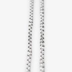 A close-up of a sterling silver belcher chain necklace against a plain white background.