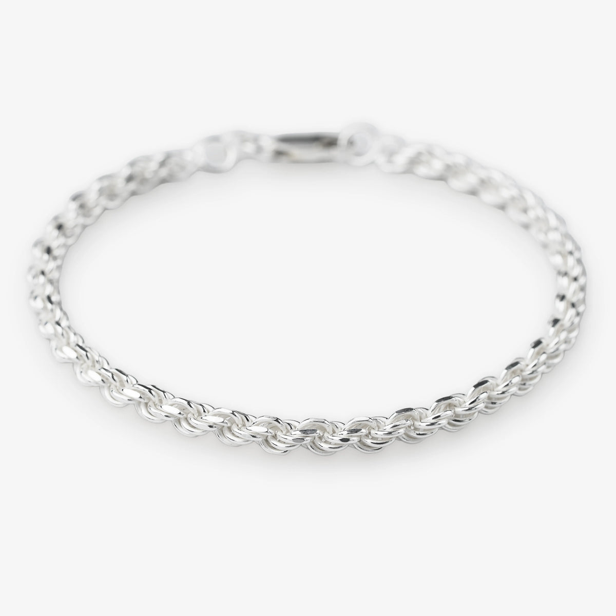 Sterling silver woven rope bracelet 925 silver on white background modern silver jewellery 