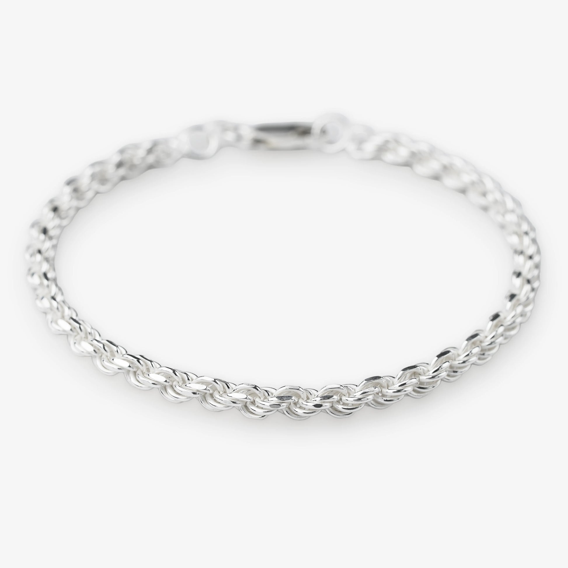 Sterling silver woven rope bracelet 925 silver on white background modern silver jewellery 