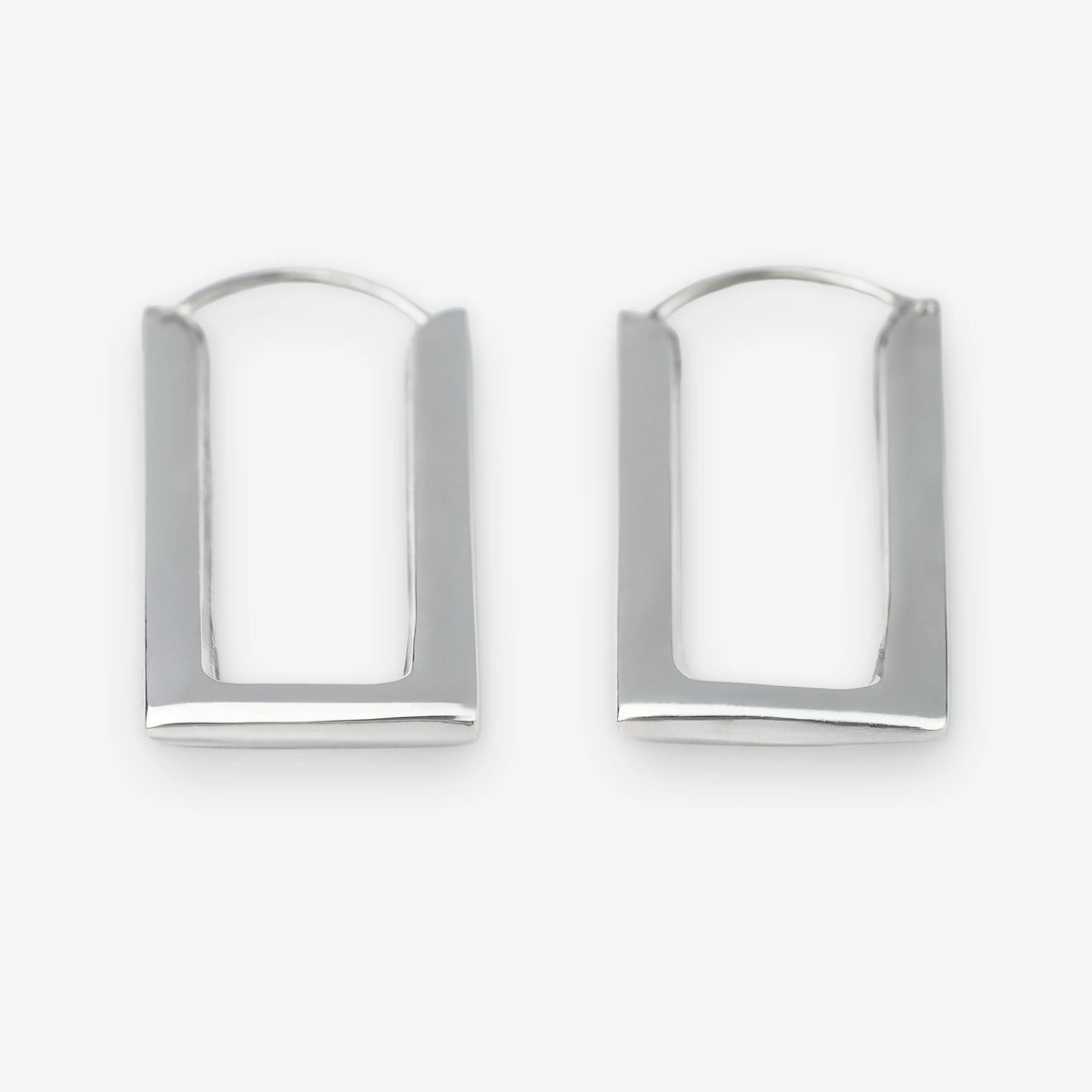 A pair of sterling silver geometric hoop earrings with a modern, open rectangular arch design, displayed on a clean white background.