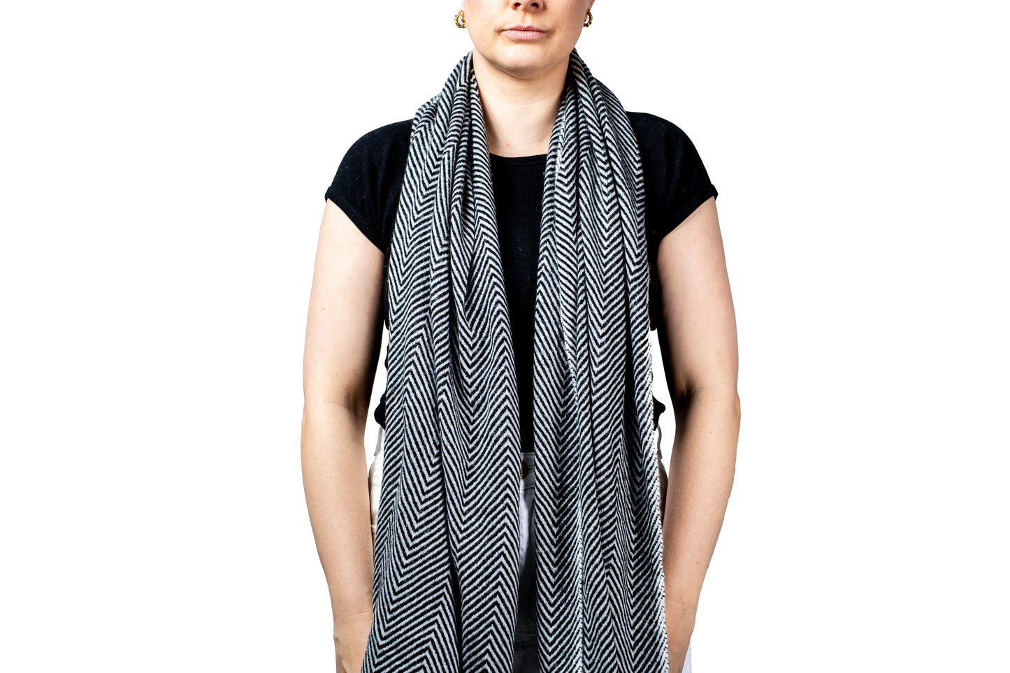 Person wearing a black and white pashmina patterned scarf on a white background- GRIHA 