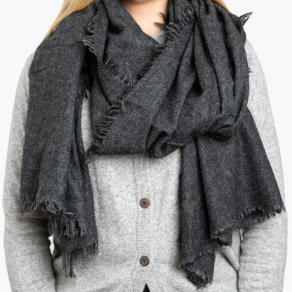 Charcoal Pure Yak Wool Shawl draped around shoulders, showing hand-frayed fringe edging